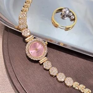 Elegant rhinestone women watch bracelet set with pink dial fashion alloy quartz timepiece.