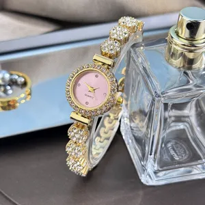 Elegant rhinestone bracelet watch with pink dial, fashion alloy quartz watch for women.