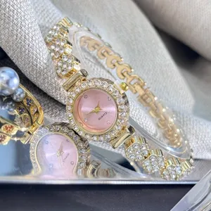 Exquisite detail view of women rhinestone quartz watch with pink dial and bracelet band.