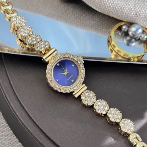 Close-up detail of a delicate rhinestone chain quartz watch with a stunning blue dial.