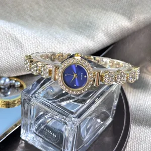 Rhinestone bracelet watch for women, exquisite blue dial quartz fashion timepiece detail.