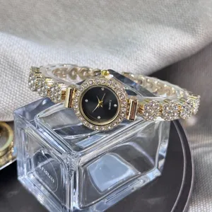 Rhinestone quartz bracelet watch for women, elegant alloy small dial fashion timepiece.