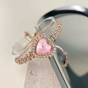 Elegante Damen Quarzuhr mit rosa Herz Strass Zifferblatt und Roségold Blumen Armband.