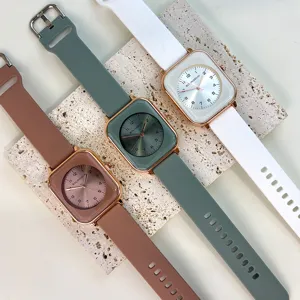 Minimalist square dial women quartz watch with soft silicone strap, elegant wrist watch detail.