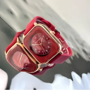 Red square quartz watch for women with soft silicone strap and clear numeric dial design.