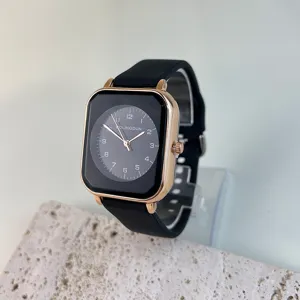 Close-up detail of women quartz watch with black silicone strap and square rose gold case.
