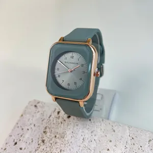 Women's square quartz watch with silicone strap, elegant green dial and rose gold case.