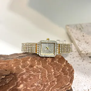 Women square rhinestone quartz watch, luxury sparkling crystal wristwatch for daily wear detail.