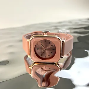 Square dial quartz watch with pink silicone strap and rose gold case for women detail view