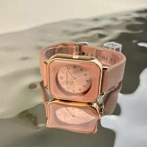 Square rose gold quartz watch featuring a pink silicone strap and clear dial detail view.