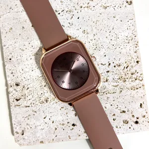 Women square quartz watch with brown silicone strap and rose gold case for daily wear.