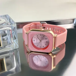 Elegant pink square dial quartz watch with soft silicone strap for women daily wear.
