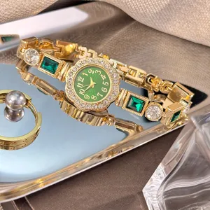 Luxury women quartz watch with green dial rhinestones and gemstone bracelet strap detail.