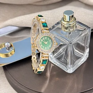 Luxury green crystal flower quartz watch for women, elegant rhinestone gemstone bracelet watch.