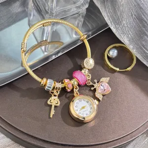 Charming alloy charm bracelet featuring quartz watch key pendant and sparkling pink crystals.