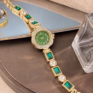 Luxury women floral rhinestone bracelet quartz watch detail with green dial and sparkling crystals.