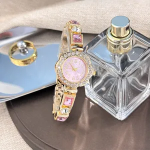 Luxury women quartz watch pink crystal rhinestone flower dial bracelet jewelry fashion gift.