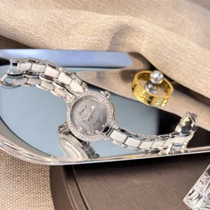 Stunning women's ceramic quartz watch with sparkling starry dial and elegant bracelet design.