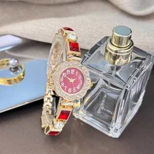 Stunning floral quartz bracelet watch featuring vibrant red gemstones and sparkling rhinestones.