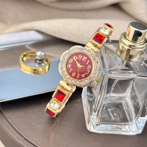 Exquisite floral rhinestone quartz women watch with sparkling red crystals and elegant bracelet band.