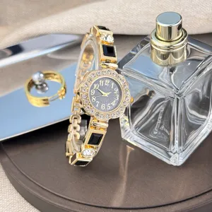 Luxury rhinestone floral quartz watch for women, stylish gold bracelet wristwatch.