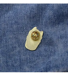 Detail view of the cute cat cake enamel pin back, showing secure metal butterfly clutch.