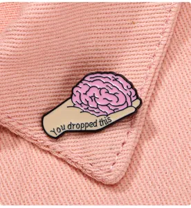 Creative hand holding brain enamel pin badge, funny brooch for clothing decoration and anti-glare.