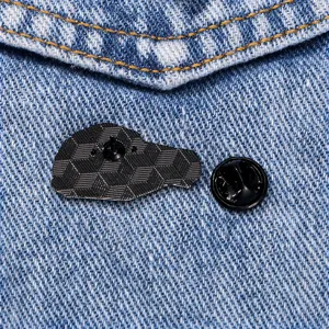 Alloy brain enamel brooch back view with clutch on denim background for fashion apparel.