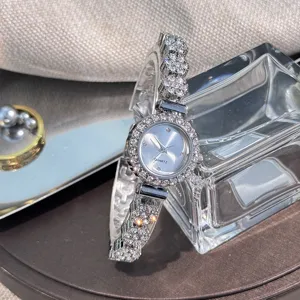 Exquisite rhinestone quartz watch with shimmering crystal bracelet band for women fashion style.