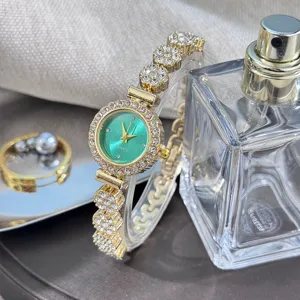 Detailed view of women rhinestone bracelet watch with elegant green dial and gold alloy band.