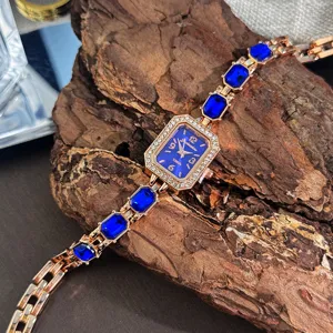 Damen Mode Rechteckige Quarzuhr Elegante Strass Eingelegte Armbanduhr Mit Farbigen Künstlichen Edelsteinen Schmuckverschluss Armbanduhr