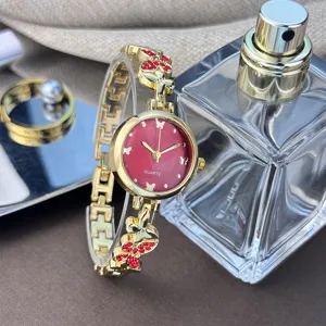 Luxus Damen Quarzuhr goldene Kettenarmband mit rotem Zifferblatt Kristall Schmetterling.