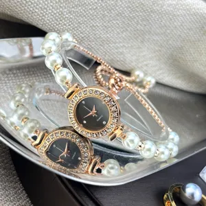 Close-up detail of luxury pearl bracelet quartz watch with sparkling rhinestone bezel elegant.