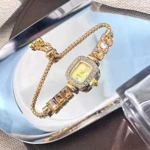 Elegant square rhinestone quartz wristwatch with adjustable pull cord and crystal chain links.