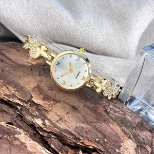 Elegante Damen Quarzuhr mit Strass Schmetterling Armband, retro Luxus Stil Design.