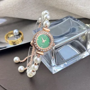 Detailed view of women rhinestone quartz pearl bracelet watch with adjustable design.