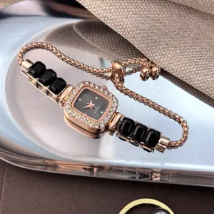 Rose gold quartz bracelet watch with square black gems, stylish women's wrist watch.