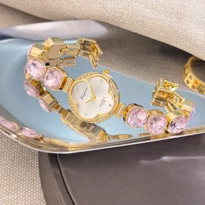 Elegante reloj de pulsera de cuarzo de trébol con diamantes de imitación rosas y oro mujer.