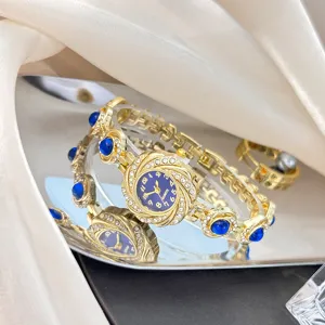 Elegante Damen Armbanduhr in Gold mit blauen Strasssteinen und Sonnenblumen Zifferblatt