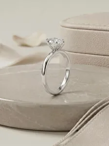 Classic six-prong solitaire moissanite ring in sterling silver, exquisite detailed view.