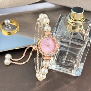 Women's luxury quartz watch with pearl bracelet strap, sparkling diamond bezel pink dial.