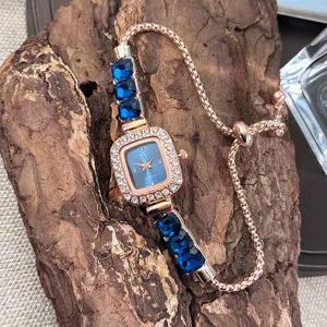 Elegant rose gold quartz watch with blue crystal and square dial for women daily wear.