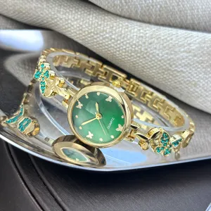 Elegante Damen Quarzarmbanduhr mit grünem Zifferblatt, goldenem Gliederarmband und Strass.