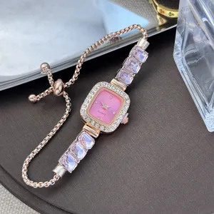 Elegant women's quartz watch with pink square dial, crystal bezel, and adjustable pull chain.