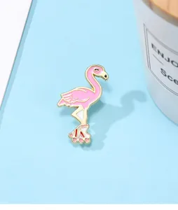 Cute pink flamingo enamel pin close-up, roller skate design, alloy brooch detail view.