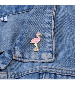 Cute flamingo enamel pin with roller skates design, perfect for denim jacket and bag decoration.