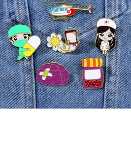 Cute medical enamel pins detail shot, featuring doctor, nurse and ambulance badge designs.