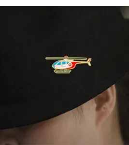 Detailed shot of a medical helicopter enamel pin, cute metal badge for clothes decoration.