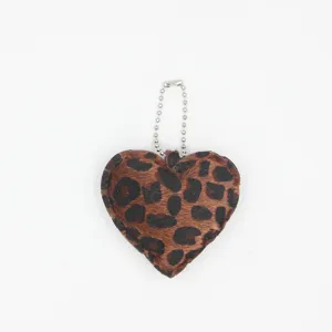 Leopard print heart plush keychain bag charm, cute fuzzy heart accessory with silver chain.