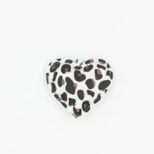 Close-up detail of the cute heart-shaped leopard print bag charm with soft texture.